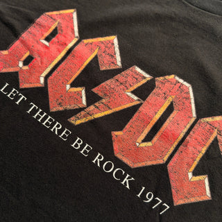 Black t-shirt with red and white 'AC/DC' logo and 'Let There Be Rock 1977' text.