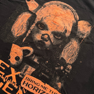 Black t-shirt with orange graphic design of a bear and text on a dark background