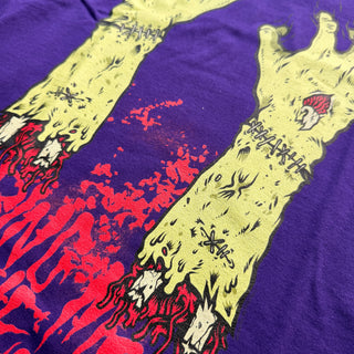 T-shirt with a graphic design of a creature on a purple and red background
