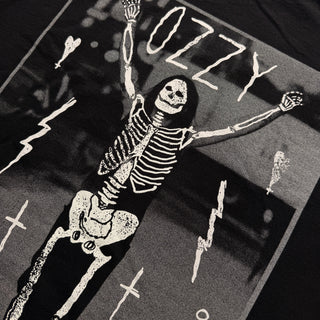 Black and white skeleton design with 'Ozzy' text on a dark background