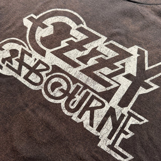 Close-up of a dark brown sweatshirt with a white graphic design on a plain background